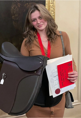 Samantha Garrett with her saddle and 1st pleace award